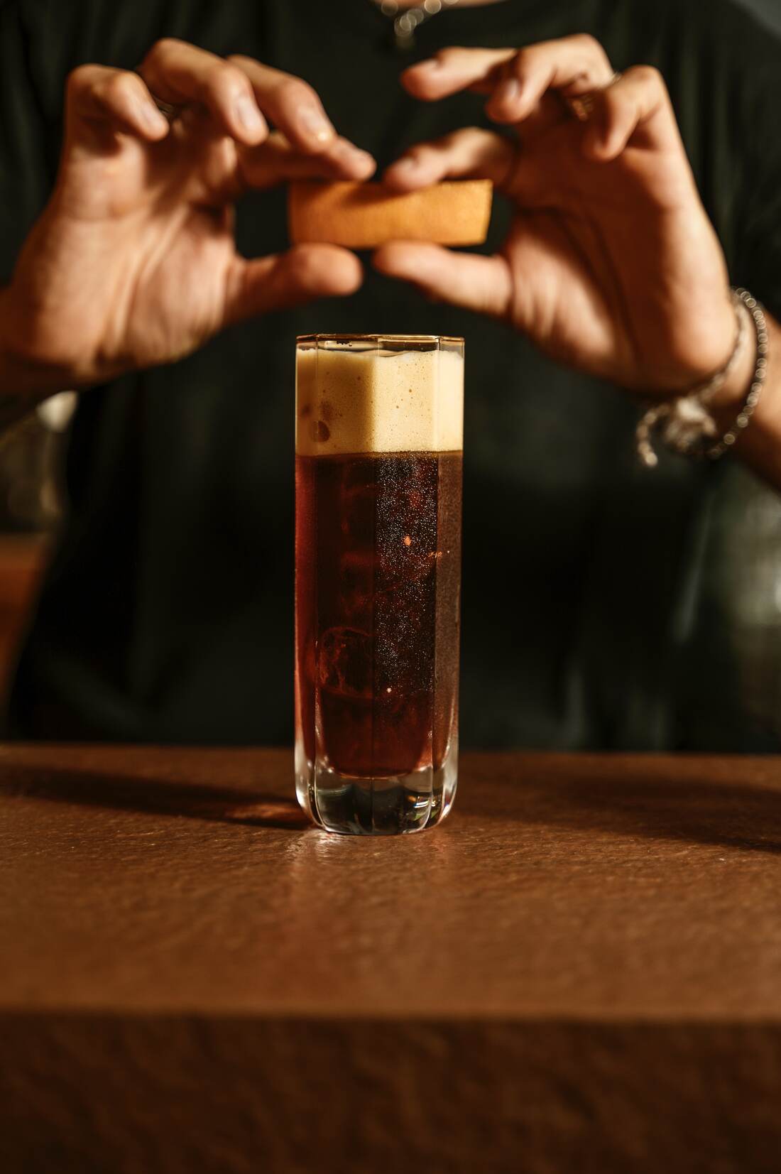 Cocktail signature con twist di arancia